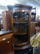 FLOOR STANDING MAHOGANY BOW FRONTED CORNER CUPBOARD with glazed door, 45? high