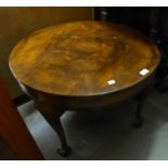 A FIGURED WALNUTWOOD CIRCULAR COFFEE TABLE, ON WELL CARVED CABRIOLE SUPPORT WITH ACANTHUS