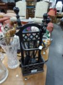A BLACK METAL FRAME MESH FOUR FOLD SPARK GUARD, WITH BLACK CAST IRON FIRESIDE COMPANION STAND WITH