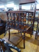 A REPRODUCTION MAHOGANY TWO TIER STAND, THE TOP INSET WITH TOOLED LEATHER, ON OUTSWEPT SUPPORTS