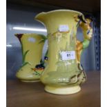 A 1950's BURLEIGH WARE JUG, WITH FIGURAL HANDLE AND A SMALLER SIMILAR BURLEIGH WARE JUG (2)