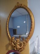 NINETEENTH CENTURY CARVED GILT WOOD AND GESSO GIRANDOLE, the oval plate within a moulded frame,