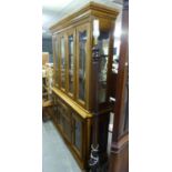 20TH CENTURY CONTINENTAL LIGHT WALNUT WOOD LARGE TWO-PART DISPLAY CABINET WITH CAVETTO CORNICE,