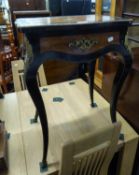 NINETEENTH CENTURY GILT METAL MOUNTED AMBOYNA AND EBONISED LADY?S TOILE TABLE, the hinged and