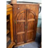 GEORGE III LINE INLAID MAHOGANY LARGE CORNER CUPBOARD enclosed by two arch topped framed three panel