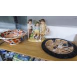 A BRETBY ART POTTERY JAPANESQUE WALL PLAQUE, A GERMAN BISQUE PORCELAIN FIGURAL GROUP AND AN EARLY