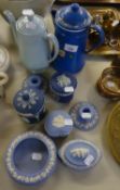WEDGWOOD PALE BLUE AND WHITE JASPER WARES, VIZ A PAIR OF LOW CANDLESTICKS, A TRINKET BOWL, TWO
