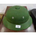 MODERN GREEN FABRIC COVERED PITH HELMET, with GILT AND RED ENAMELLED BADGE, possibly Chinese?