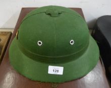 MODERN GREEN FABRIC COVERED PITH HELMET, with GILT AND RED ENAMELLED BADGE, possibly Chinese?