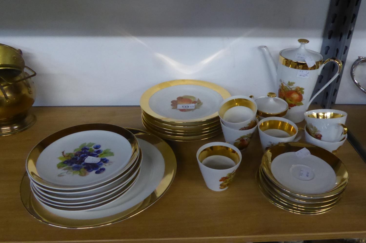 A COMPOSITE 29 PIECE BAVARIAN AND CZECHOSLOVAKIAN GOLD BORDERED AND FRUIT PRINTED TEA SERVICE