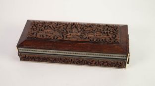 EARLY TWENTIETH CENTURY INDIAN CARVED HARDWOOD AND IVORY INLAID OBLONG BOX, the hinge top with