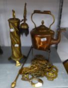 AN ANTIQUE COPPER CIRCULAR KETTLE, ON A PIERCED BRASS TRIVET AND A BRASS SPIRALLY FLUTED FIRESIDE