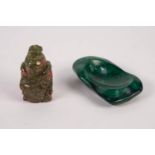 A MALACHITE IRREGULAR SHAPED ASHTRAY, 4" LONG AND A GREEN AND RED SPECKLE, CARVED HARDSTONE SEATED