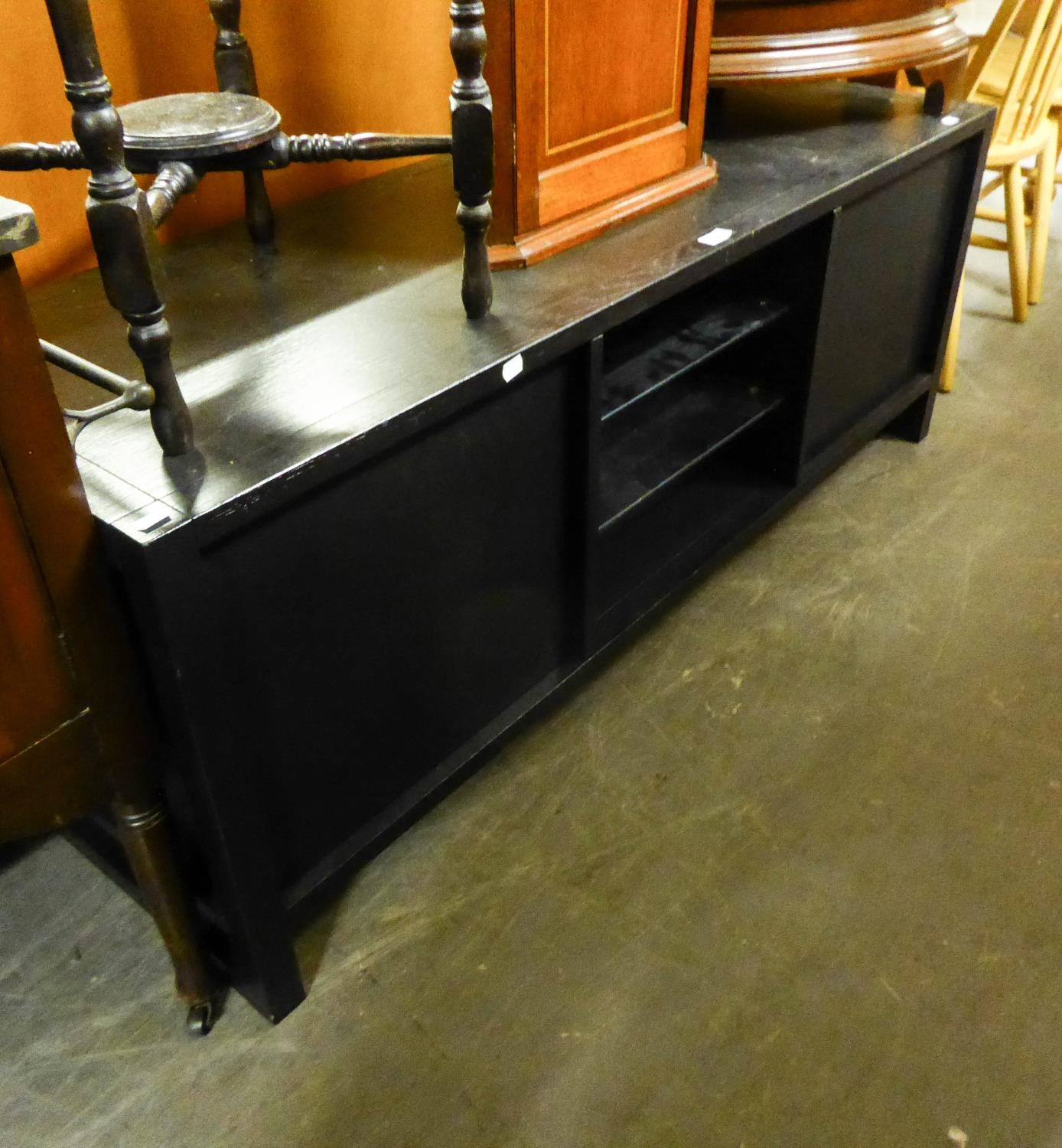 BLACK PAINTED T.V UNIT, with two central glass shelves and end cupboard doors, 22 ¼? high, 59? x 19?
