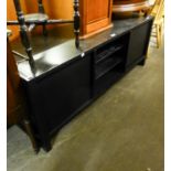 BLACK PAINTED T.V UNIT, with two central glass shelves and end cupboard doors, 22 ¼? high, 59? x 19?
