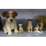A LARGE COMPOSITION MODEL OF A SEATED DOG; TWO SMALL RESIN MODELS OF DOGS AND A BEATRIX POTTER GROUP