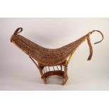 CHILD?S WOVEN WICKER BASKET SADDLE, with brown leather fittings