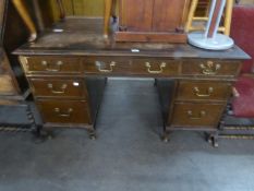 A MAHOGANY DOUBLE PEDESTAL DESK WITH SEVEN DRAWERS, ON STUMP CABRIOLE FEET (DISTRESSED)