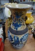 AN EARLY TWENTIETH CENTURY ORIENTAL STONEWARE VASE, BLUE AND WHITE DECORATION WITH BIRDS AMONGST