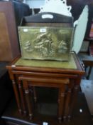 A PERIODICAL RACK WITH BRASS FRONT EMBOSSED WITH A GALLEON AND A NEST OF THREE MAHOGANY OBLONG