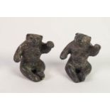 TWO INDENTICAL CAST LEAD INFANT'S RATTLES, in the form of seated bears 2 in (5cm) high
