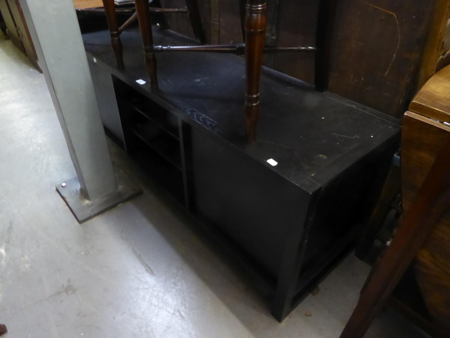 BLACK PAINTED T.V UNIT, with two central glass shelves and end cupboard doors, 22 ¼? high, 59? x 19? - Image 2 of 2