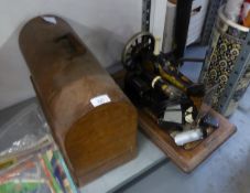 TWO VINTAGE HAND SEWING MACHINES, BOTH IN OAK CASES, ONE WITH DOMED TOP (2)
