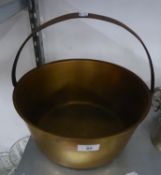 A LARGE BRASS JAM PAN WITH HOOP HANDLE