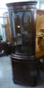 GEORGIAN STYLE MAHOGANY DOUBLE CORNER CUPBOARD, WITH BOW FRONT ASTRAGAL GLAZED UPPER DOOR