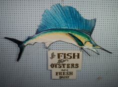 FISH SHOP SIGN, IN THE FORM OF A PAINTED WOOD BLUE MARLIN, having fret cut sail fin, the small