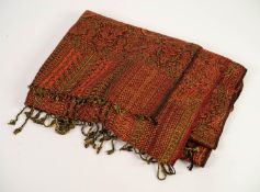 MACHINE WOVEN PAISLEY SHAWL OR WRAP of typical design in brown, orange and red, fringed to short