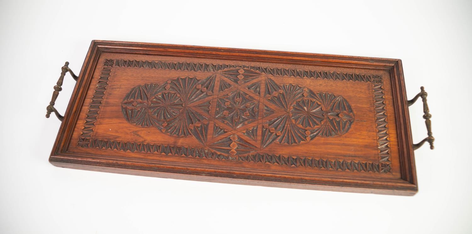 CIRCA 1920's OAK TWO HANDLE NARROW OBLONG TRAY, with chip carved decoration, metal bale handles, 22"