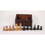 EARLY TWENTIETH CENTURY BOXWOOD AND EBONY STAUNTON PATTERN CHESS SET, with weighted bases, the green