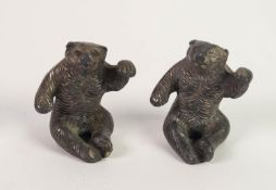 TWO INDENTICAL CAST LEAD INFANT'S RATTLES, in the form of seated bears 2 in (5cm) high
