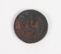 POSSIBLY ROMAN HAMMERED BRONZE COIN, obverse with a laurel garlanded head facing left, reverse