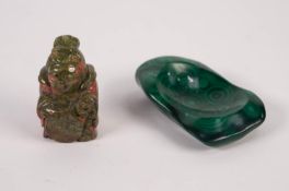 A MALACHITE IRREGULAR SHAPED ASHTRAY, 4" LONG AND A GREEN AND RED SPECKLE, CARVED HARDSTONE SEATED