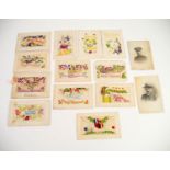TWELVE WORLD WAR I POSTCARD SILKS, half having the silk embroidery being in the form of an envelope,