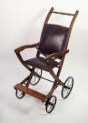 LATE VICTORIAN CHILD'S HARD WOOD FOLD-FLAT PUSHCHAIR, with studded hide back panel and seat, foot