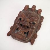 LARGE INDONESIAN CARVED SOFTWOOD WALL MASK, 13? x 9? (33cm x 22.9cm)