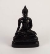 TWENTIETH CENTURY BLACK COMPOSITION FIGURE OF A THAI BUDDHISTIC FIGURE, seated cross-legged, 8" (