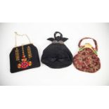 LADIES PRE-WAR BLACK SUEDE LEATHER HANDBAG of organic form with oriental metal clasp/collar set with