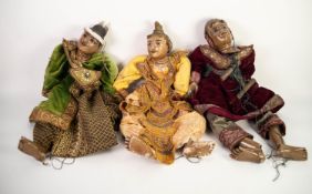 NINE BURMESE POST-WAR CARVED AND PAINTED WOOD MARIONETTE PUPPETS, depicting various characters,