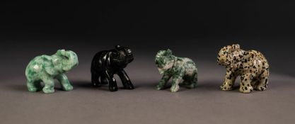 THREE CHINESE SPECKLED JADE SMALL MODELS OF ELEPHANTS and ONE DARK BROWN, all with trunks folded
