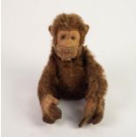 POSSIBLY EARLY STEIFF CINNAMON MOHAIR MONKEY with felt face, hands and feet, glass inset eyes, 7in (