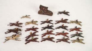 SEVENTEEN EARLY TWENTIETH CENTURY DIE CAST STEEPLE CHASE HORSE AND RIDER FIGURES, probably for