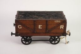UNUSUAL CIRCA 1920's OAK AND CAST METAL JEWELLERY BOX, IN THE FORM OF A G.E.R RAILWAY COAL WAGON,