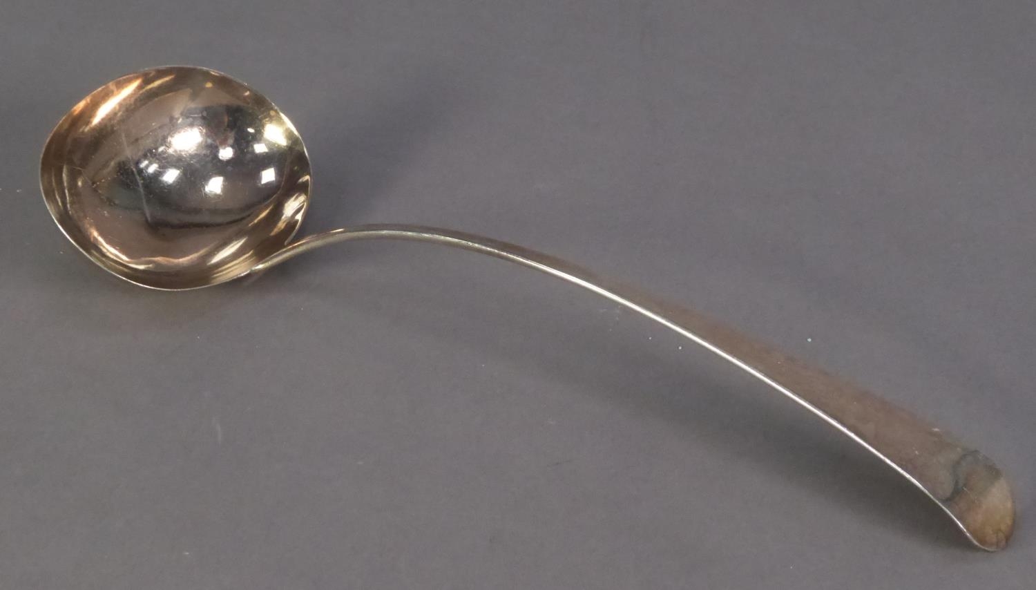 GEORGE III SILVER EARLY ENGLISH PATTERN SOUP LADLE BY PETER & WILLIAM BATEMAN, 12 ½? (31.7cm)