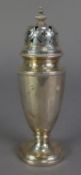 GEORGE V SILVER PEDESTAL SUGAR CASTOR, with pointed finial to the push on top, short stem and