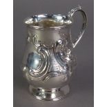 VICTORIAN EMBOSSED SILVER CHRISTENING MUG BY HENRY WILLIAM CURRY, of footed baluster form with