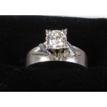 18ct WHITE MATT GOLD RING with broad flat shank with a round brilliant cut solitaire diamond in a